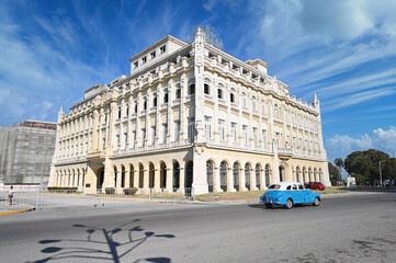 Architecture of Old Havana in Cuba. Everyday life with cars, houses and people.