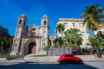 Architecture of Old Havana in Cuba. Everyday life with cars, houses and people.