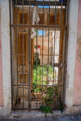 Architecture of Old Havana in Cuba. Everyday life with cars, houses and people.