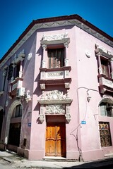 Architecture of Old Havana in Cuba. Everyday life with cars, houses and people.