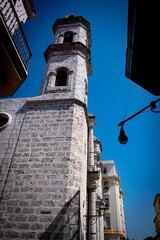 Architecture of Old Havana in Cuba. Everyday life with cars, houses and people.