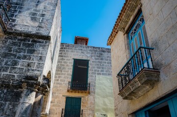 Architecture of Old Havana in Cuba. Everyday life with cars, houses and people.