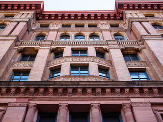 Philadelphia Bourse building seen from below in symmetrical perspective.