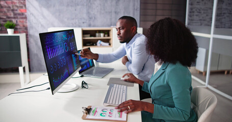 African American Analyst Using Financial Business Data