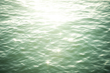 ocean water surface with sunlight and bokeh