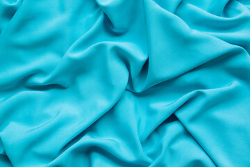 Obraz premium Background from turquoise fabric. The texture of the fabric.