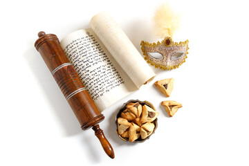 The Scroll of Esther and Purim Festival objects (rattles, masquerade mask, Hamantaschen) on white...