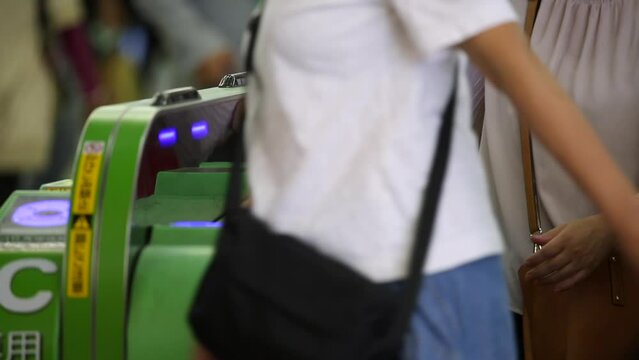 Shinjuku Ticket Gates in Tokyo Metro. Pasmo Card or Suica Card. People Taping Card to go Through the Gate. Tokyo Underground Metro Network