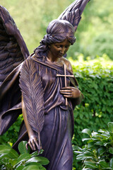 Bronze grave angel with feather