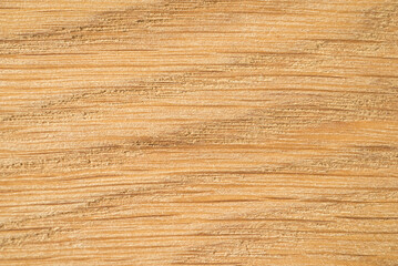 A close up of a wood texture that is brown and has a rough texture.