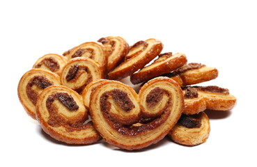 Puff pastry with butter and cinnamon isolated on white, side view