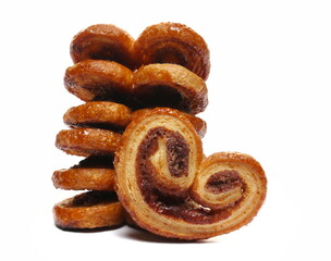 Puff pastry with butter and cinnamon isolated on white, side view