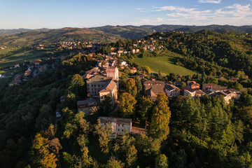 Fototapeta na wymiar 4k drone flight over the Castle of Guiglia and its forest at golden hour in Italy 