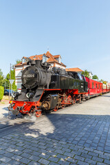 Baederbahn Molli steam train locomotive railway portrait format in Bad Doberan, Germany