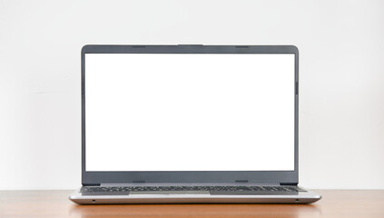 Laptop with blank transparent display on empty wooden table against white wall background, copy...
