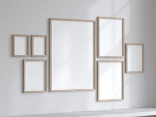 Frames on the wall. Mockup frames kit. Wooden frames. Empty frames.