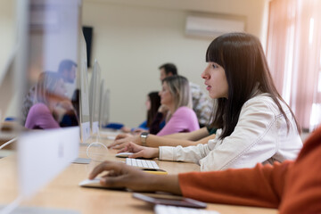Young people in programming school.Students Learning In A Programing Class