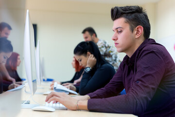 Young people in programming school.Students Learning In A Programing Class