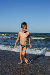 child playing on the ocean seashore