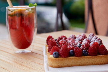 Sugar free french tart with raspberry and blueberry at the terrace. Refreshing raspberry - orange...