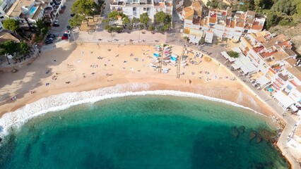 aerial view of the beautiful beach from Tamariu in a bay on the Mediterranean Sea with a promenade...