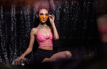 euphoria inspired editorial photo shoot glitter background purple black model caucasian hispanic...