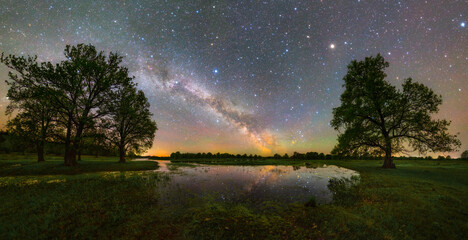 Starry sky over a small river