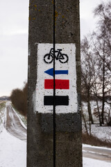 Bicycle route signs on a concrete pole
