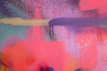 Messy paint strokes and smudges on an old painted wall with graffiti. Colorful drips, flows,...