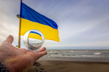 Flag of Ukraine on the pier 