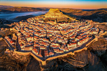 Aerial view at sunrise above the beautiful village of Morella in the mountains of Castellón