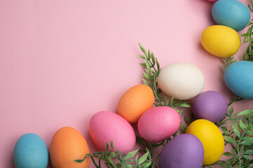 Fototapeta na wymiar Bright Easter Eggs on Pink Background