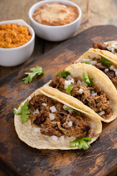 Pork Carnitas Tacos On A Cutting Board