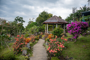Gazebo in beautiful blooming garden in Thailand, Southeast Asia