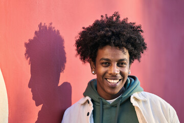 Close up portrait photo of young stylish happy African American cool hipster guy face laughing on...