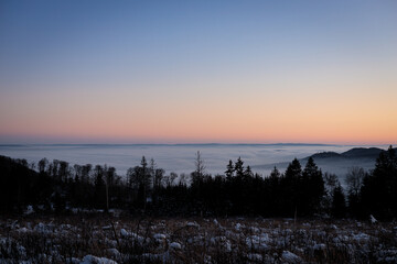 sunset over a foggy valley