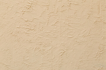 Rough textured wall surface, decorative plaster. Backdrop for design, graphic resource. Texture background.