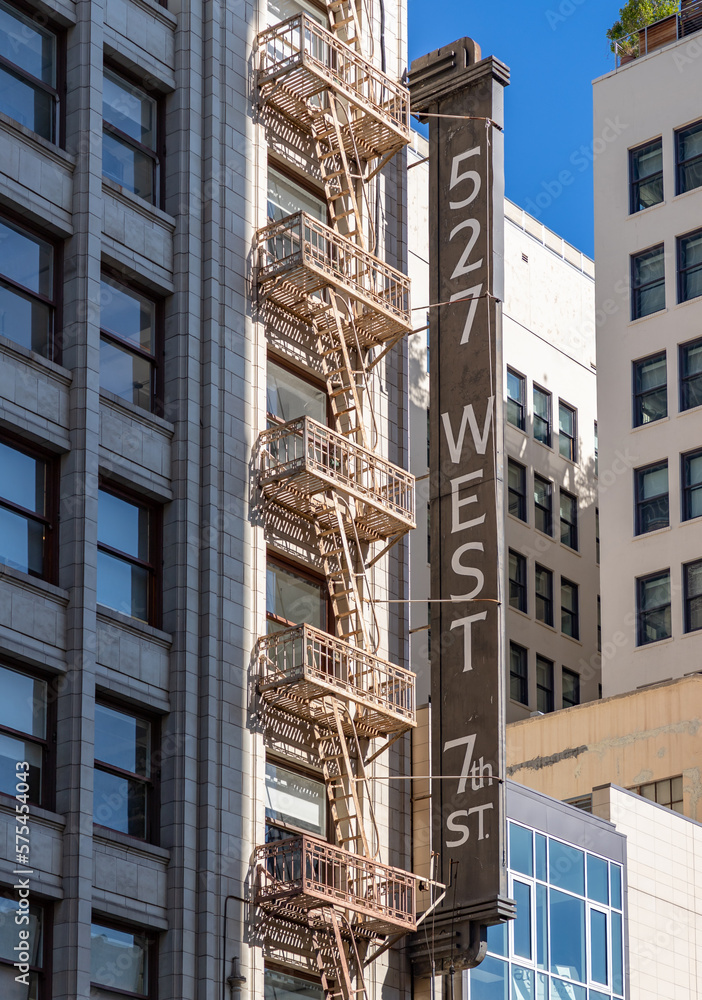 Wall mural 527 West 7th Street Sign and Fire Escape