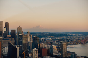 Fototapeta na wymiar View of Seattle skyline at dusk on summer evening with view of Mount Rainer, Washington State