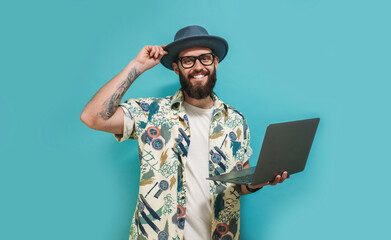 Young crazy bearded charismatic man. Shocked or surprised expression. Laptop concept. Funny...