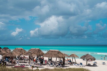 Varadero beach in Cuba in the year 2023. Blue sea, clear sky and many tourists on the beach.