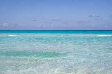 Varadero beach in Cuba in the year 2023. Blue sea, clear sky and many tourists on the beach.