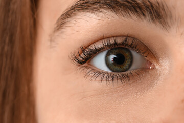 Young woman with green eyes, closeup