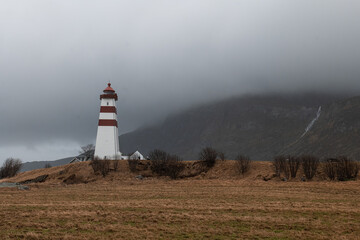 Alnes Fyr Lighthouse in Norway on an island in moody weather - obrazy, fototapety, plakaty