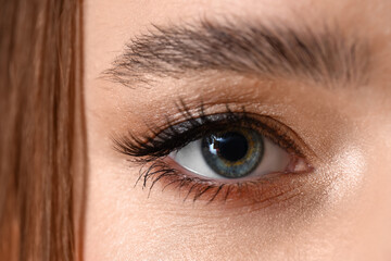 Obraz premium Young woman with blue eyes, closeup