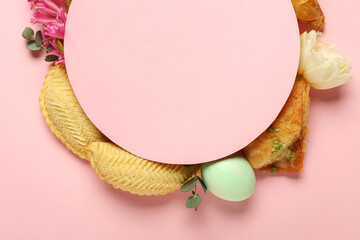 Blank card with flowers, eggs and treats on pink background. Novruz Bayram celebration