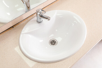 Fototapeta premium White ceramic sink on table