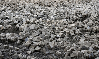 Granite paving stones pulled out from the road