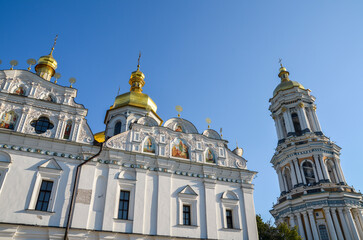 Fototapeta na wymiar The Great Lavra Bell Tower and Holy Dormition cathedral on the territory of Kyiv Pechersk Lavra, also known as Monastery of the Caves, is a historic Orthodox Christian monastery. Ukraine