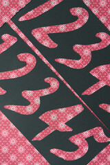 black paper stencils with number cutouts